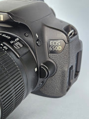 a) Canon EOS 650D DSLR Camera with 18-55mm f/3.5-5.6 IS Lens | 18MP APS-C Sensor | Full HD Video | Vari-Angle Touchscreen | Beginner Friendly Photography Camera 📸🔥